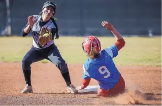  ?? ROBERTO E. ROSALES/JOURNAL ?? Volcano Vista’s Jaden Encinas, left, will be a second too late in applying the tag at second base to a sliding Sandia runner Jayleen Burton (9). The Hawks won the APS Metro softball semifinal 9-8.