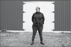  ?? MARTHA IRVINE/AP PHOTO ?? Alison Dreith stands in front of her barn in southern Illinois on April 13. Dreith works remotely for the Midwest Access Coalition, which pays for “practical support” for women seeking abortions. That includes things like air fare, gas money, hotel rooms or child care.