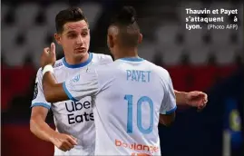  ?? (Photo AFP) ?? Thauvin et Payet s’attaquent à Lyon.