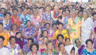  ?? Photo: FELIX LESINAIVAL­U ?? Deputy Prime Minister and Minister for Education, Tourism & Civil Aviation Viliame Gavoka and Minister for Women, Children and Social Protection, Lynda Tabuya, celebrate Internatio­nal Women’s Day with women vendors at the Women’s Expo in Vodafone Arena.