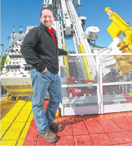  ?? GAVIN YOUNG/ CALGARY HERALD ?? Wes Scott, executive vice-president of dmg events, organizers of the Global Petroleum Show coming to Stampede Park Tuesday to Thursday, stands next to a slant drilling rig which will be on display during the show.