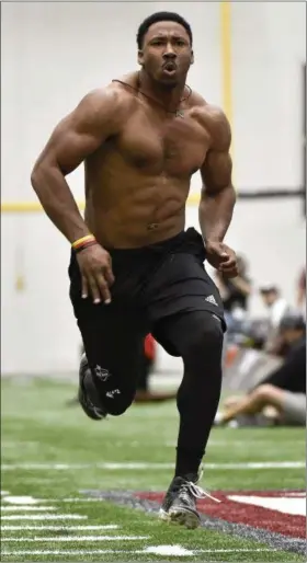  ?? ERIC CHRISTIAN SMITH — ASSOCIATED PRESS ?? Former Texas A&M defensive end Myles Garrett runs a 40‑yard dash during Texas A&M Pro Day at the football team’s indoor training facility on March 30.