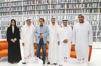  ?? ?? Iraqi poet Kareem Al Iraqi and Emirati poet Ebrahim Mohammad Ebrahim with officials of Mohammad Bin Rashid Library and other poets at the Arabic Language Day programme.