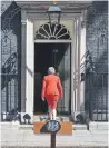  ?? AFP/GETTY IMAGES ?? British PM Theresa May returns to 10 Downing St. after announcing her resignatio­n.