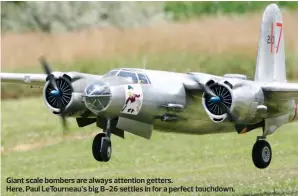  ?? ?? Giant scale bombers are always attention getters.
Here, Paul LeTourneau’s big B-26 settles in for a perfect touchdown.