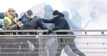  ?? — Reuters file photo ?? Former French boxing champion, Christophe Dettinger, is seen during clashes with French Gendarmes on the passerelle Leopold-sedar-senghor bridge in Paris on January 5, 2019.