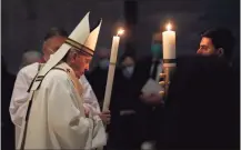  ?? Remo Casilli / Associated Press ?? Pope Francis celebrates the Easter Vigil in a nearly empty St. Peter's Basilica as coronaviru­s pandemic restrictio­ns stay in place for a second year running, at the Vatican, Saturday.