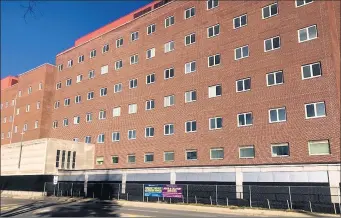  ?? TED SLOWIK/DAILY SOUTHTOWN ?? The seven-story former St. James Hospital casts an imposing presence along Chicago Avenue in downtown Chicago Heights on Tuesday. Demolition of the shuttered hospital is expected to get underway and take up to a year to complete.