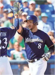  ?? ROY DABNER / FOR THE JOURNAL SENTINEL ?? The Brewers’ Ryan Braun hits a two-run homer on Friday.