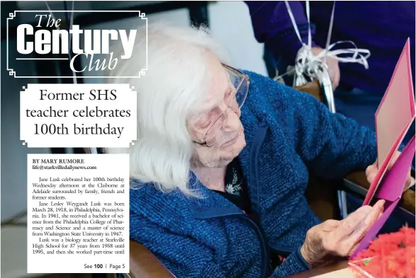  ?? (Photo by Mary Rumore, SDN) ?? Jane Lusk opened the stack of dozens of birthday cards she received from friends, family and former students during her 100th birthday party.