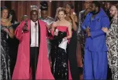  ?? CHARLES SYKES — INVISION/AP ?? Michael R. Jackson, second from left, accepts the award for best new musical for “A Strange Loop” at the 75th annual Tony Awards on Sunday in New York.