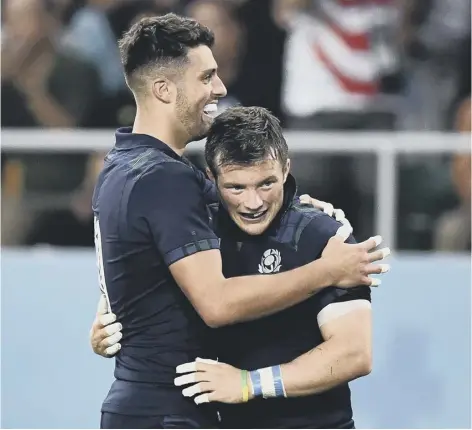  ??  ?? 0 Stand-off Adam Hastings, left, scored two tries and scrum-half George Horne got three as Scotland thrashed Russia.