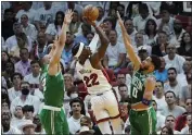  ?? LYNNE SLADKY — THE ASSOCIATED PRESS ?? Boston Celtics forwards Jayson Tatum (0) and Grant Williams (12) defend Miami Heat forward Jimmy Butler (22) during the second half of Game 7of the Eastern Conference Finals on Sunday in Miami.