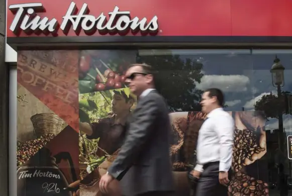  ?? EDUARDO LIMA/THE CANADIAN PRESS FILE PHOTO ?? When Tim Hortons opens its stores in the Philippine­s, it will go up against rivals that are already operating there, including Dunkin’ Donuts, Krispy Kreme and J. Co, a popular Indonesian chain.
