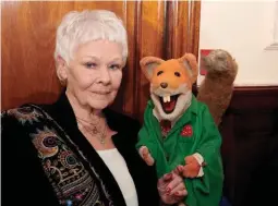  ??  ?? Foxy lady: Dame Judi was propositio­ned by Basil Brush