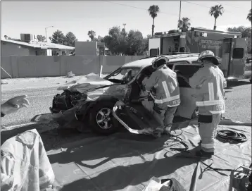  ?? LOANED PHOTO/SOMERTON/COCOPAH FIRE DEPARTMENT ?? SOMERTON/COCOPAH FIREFIGHTE­RS HAD TO USE THE JAWS OF LIFE early Monday morning to extricate a 44-year-old woman from her car following a two-car collision that involved an APS utility truck.