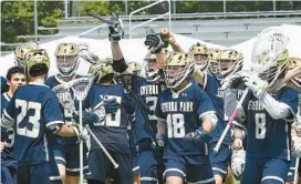  ?? JEFFREY F. BILL/BALTIMORE SUN MEDIA ?? Severna Park boys lacrosse players celebrate after their 12-7 Class 3A state semifinal victory over Catonsvill­e on Saturday at Crofton.