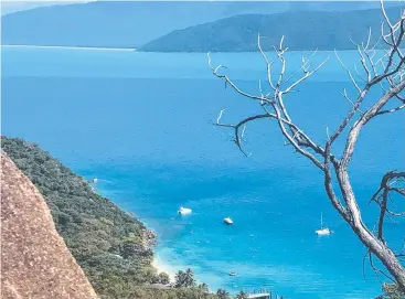  ?? Picture: DANIEL BATEMAN ?? REWARD: The view from the top of Fitzroy Island, which can be reached via the 5km summit circuit which takes hikers past the lighthouse (right).