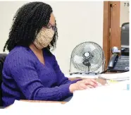  ?? (Pine Bluff Commercial/I.C. Murrell) ?? Kristy Sanders, the Watson Chapel School District’s K-12 curriculum director, goes over paperwork Wednesday in her office at the junior high school.