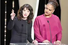  ??  ?? Argento (left) speaks on stage as director and jury member DuVernay listens on Saturday for the closing ceremony of Cannes festival. — AFP photo