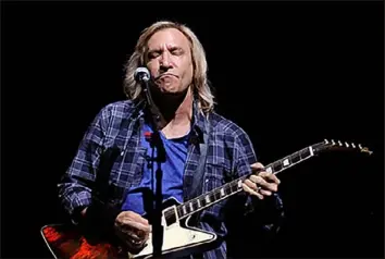  ?? Post-Gazette ?? Joe Walsh, seen performing with The Eagles at PPG Paints Arena in 2013, witnessed the events of May 4, 1970.