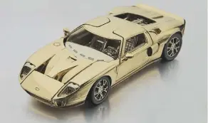  ??  ?? The 1/25-scale replica is made from two-toned 18-karat gold.