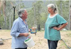  ??  ?? Gary Wilson and Julie Willis chat outside their home in Wytaliba.