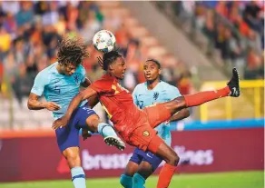  ?? AFP ?? Netherland­s’ Nathan Ake (left) vies with Belgium’s Derrick Boyata (right) during a friendly at the King Baudouin Stadium on Tuesday in Brussels.