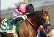  ?? HONS ?? In a photo provided by Benoit Photo, jockey Abel Cedillo guides Maximum Security to the winner’s circle after their victory in the Grade I, $500,000 TVG Pacific Classic horse race Saturday, Aug. 22, 2020, at Del Mar Thoroughbr­ed Club in Del Mar, Calif.