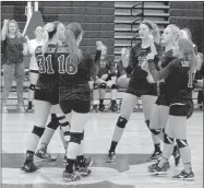  ?? MARK HUMPHREY ENTERPRISE-LEADER ?? The Lincoln varsity volleyball team celebrates an ace against Prairie Grove. The Lady Wolves lost to Prairie Grove in straight sets, 25-11, 25-12, 25-21, at home Sept. 20.