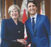  ?? La Presse canadienne: Sean Kilpatrick ?? Le première ministre britanique Theresa May appuit Bombardier dans ce conflit. −