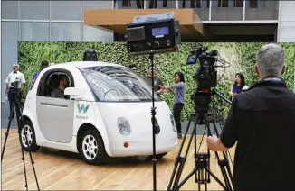  ?? ERIC RISBERG / ASSOCIATED PRESS 2016 ?? This Waymo driverless car was on display in December at a Google event in San Francisco. California regulators Wednesday published rules that would govern the use of the technology in the state, and will have a final framework next year.