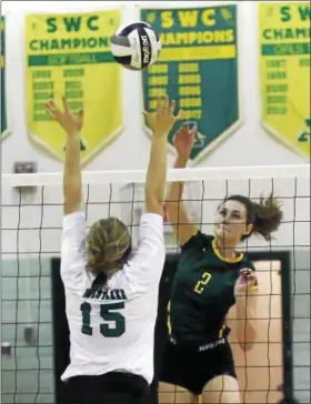  ?? RANDY MEYERS — THE MORNING JOURNAL ?? Sarah Farley of Amherst spikes the ball over Audrey Lyle of Westlake during the second set of the Comets win on Sept. 19.