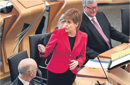  ?? Picture: Getty Images. ?? First Minister Nicola Sturgeon answers questions in the Scottish Parliament.