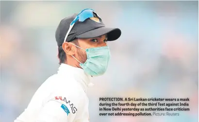  ?? Picture: Reuters ?? PROTECTION. A Sri Lankan cricketer wears a mask during the fourth day of the third Test against India in New Delhi yesterday as authoritie­s face criticism over not addressing pollution.