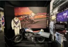  ?? ORLIN WAGNER — THE ASSOCIATED PRESS ?? The cycle and leathers used by Evel Knievel at his Kansas City Internatio­nal Speedway jump are on display at the Evel Knievel Museum in Topeka, Kan., Friday. A new Kansas museum is giving enthusiast­s of late motorcycle daredevil Evel Knievel a jump on...