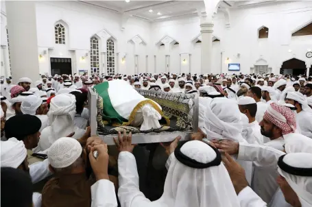  ?? Pawan Singh / The National ?? Family members and friends carry the body of UAE martyr Sameer Mohammed Murad Abu Bakr