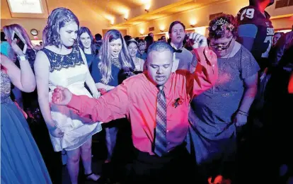  ?? [PHOTOS BY SARAH PHIPPS, THE OKLAHOMAN] ?? Alphonso Humphrey dances during the 2017 “Night to Shine” prom-night event hosted by Putnam City Baptist Church, 11401 N Rockwell, in partnershi­p with the Tim Tebow Foundation.