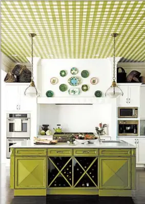  ?? ERIC PIASECKI/MENDELSON GROUP ?? This Gideon Mendelson-designed kitchen in Westcheste­r County in New York shows personalit­y with a green checkered ceiling. The color matches the green on the kitchen island.