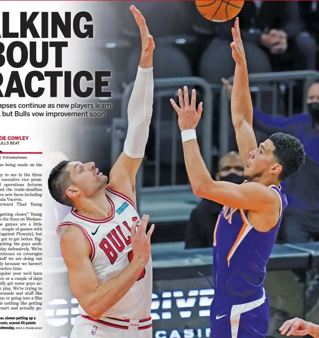  ?? ROSS D. FRANKLIN/AP ?? Suns guard Devin Booker, shown putting up a shot against Nikola Vucevic, scored 45 points against the Bulls on Wednesday.