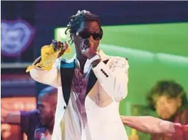  ?? ROBYN BECK/GETTY ?? Jeffery Williams (aka “Young Thug”) performs in Los Angeles during the 61st Annual Grammy Awards in 2019. Williams is now on trial in Georgia, in a case where his lyrics of vague metaphors like “ready for war like I’m Russia” were admitted as evidence of “an overt act in furtheranc­e of conspiracy.”