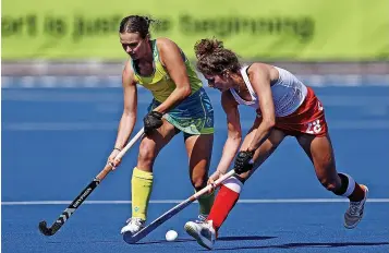  ?? ?? Flora Peel, right, battles with Rebecca Greiner of Australia in the gold medal match