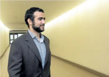  ?? THE CANADIAN PRESS FILES ?? Omar Khadr leaves court after a judge ruled to relax bail conditions in Edmonton on Sept. 18, 2015. The Canadian government will pay former Guantanamo Bay prisoner Omar Khadr more than $10 million and officially apologize to him in settlement of a...