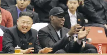  ?? JASON MOJICA/THE Associated Press ?? North Korean leader Kim Jong Un and former NBA star Dennis Rodman watch North Korean and U.S. players
in a basketball game in Pyongyang, North Korea, on Thursday.