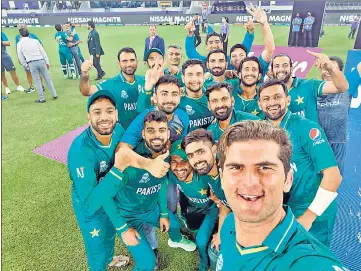  ?? ANI ?? Pakistan's Shaheen Shah Afridi (R) takes a selfie with his teammates after beating India in Dubai on Sunday.