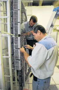  ?? Picture: ROBERT TSHABALALA ?? WIRED: Telkom network technician­s connect wiring at Loftus Versfeld Stadium in Pretoria. Telkom has adopted a ’razor-sharp’ focus on its enterprise and infrastruc­ture offerings