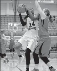  ?? NWA Democrat-Gazette/ANDY SHUPE ?? Springdale forward Marquesha Davis looks to shoot over Cabot defender Camryn Harmon during the Class 7A girls state basketball tournament Wednesday at Van Buren. Davis finished with 18 points and 10 rebounds to lead the Lady Bulldogs to a 49-46...