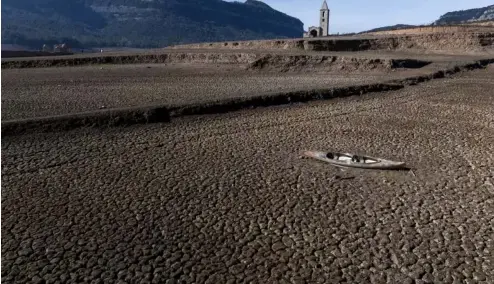  ?? ?? The almost empty Sau reservoir north of Barcelona last week. The city has declared a drought emergency after years of low rainfall.