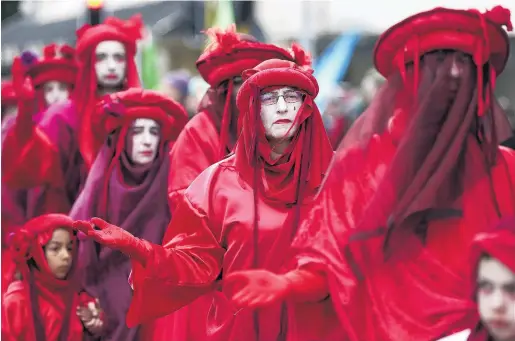  ?? PHOTO: GETTY IMAGES ?? Global campaign . . . Protesters march in Wellington yesterday during an event organised to bring attention to climate change.