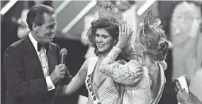  ?? RAUL DE MOLINA, AP ?? Miss Universe 1985 Deborah Carthy-deu, of San Juan, smiles as she is crowned by TV personalit­y Bob Barker after the close of the Miss Universe Pageant in Miami on July 15, 1985.